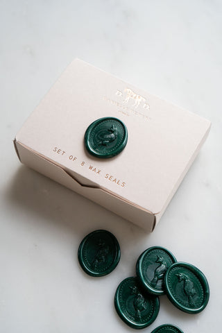 Wax seals are packaged in a small foil stamped box designed and printed in studio.