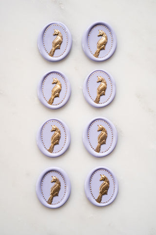 Photo of a set of 8 lavender fox wax seals with gold painted details by Danielle Demers