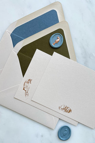 Photo of a set of correspondence cards featuring foil stamped fox designs and lined envelopes by equine artist Danielle Demers