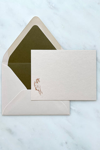 Photo of a correspondence card and matching envelope. Card features a copper foil stamped drawing of a sitting fox by equine artist Danielle Demers.