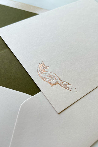 Photo of a correspondence card and matching envelope. Card features a copper foil stamped drawing of a sitting fox by equine artist Danielle Demers.