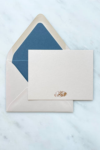 Photo of a correspondence card and matching envelope. Card features a copper foil stamped drawing of a sleeping fox by equine artist Danielle Demers.