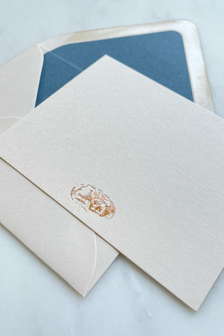 Photo of a correspondence card and matching envelope. Card features a copper foil stamped drawing of a sleeping fox by equine artist Danielle Demers.