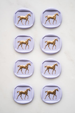 Photo of a set of 8 lavender horse wax seals with gold hand painted detail by equine artist Danielle Demers