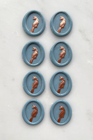 Photo of a set of 8 French blue fox wax seals with copper painted details by Danielle Demers