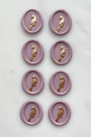Photo of a set of 8 dusty rose fox wax seals with gold painted details by Danielle Demers