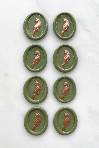 Photo of a set of 8 sap green fox wax seals with copper painted details by Danielle Demers