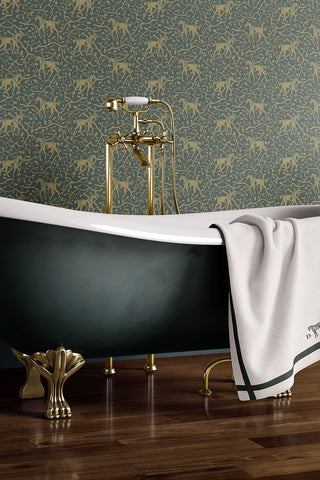 Interior bathroom scene featuring Amongst the Oaks wallpaper in the colorway "Deep Green Earth." Designed by equine artist Danielle Demers.
