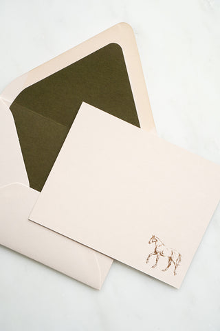 Photo of a copper foil stamped correspondence card featuring a tiny drawing of a horse walking by equine artist Danielle Demers.