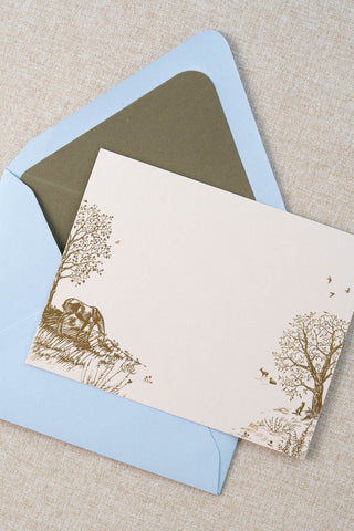 Foil stamped correspondence card featuring a summer scene with a horse, deer, lavender, roses, trees and birds. Gold foil design on cream card stock with a light blue envelope lined in a muted moss green liner.