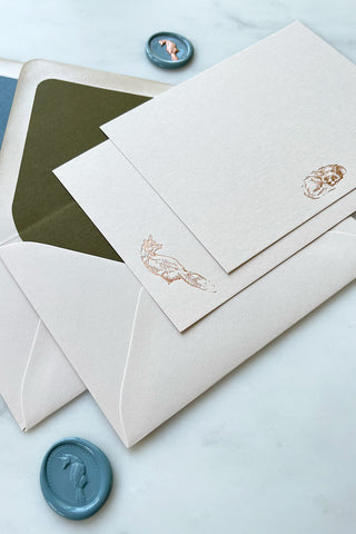 Photo of a set of correspondence cards featuring foil stamped fox designs and lined envelopes by equine artist Danielle Demers