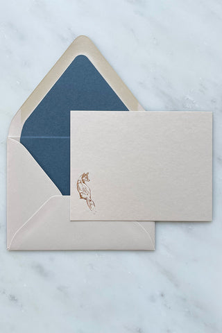 Photo of a correspondence card and matching envelope. Card features a copper foil stamped drawing of a sitting fox by equine artist Danielle Demers.