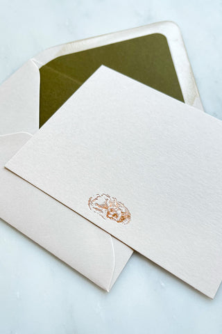 Photo of a correspondence card and matching envelope. Card features a copper foil stamped drawing of a sleeping fox by equine artist Danielle Demers.