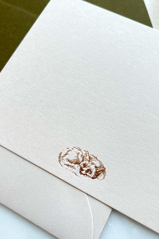 Photo of a correspondence card and matching envelope. Card features a copper foil stamped drawing of a sleeping fox by equine artist Danielle Demers.