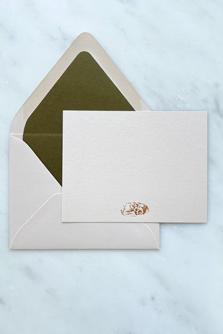Photo of a correspondence card and matching envelope. Card features a copper foil stamped drawing of a sleeping fox by equine artist Danielle Demers.