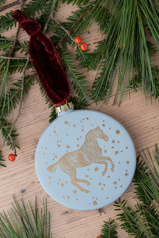 PRE-ORDER: "Snow Day" Block-Printed Horse Motif Ceramic Ornament – Snowlight Blue & Gold with Garnet Ribbon