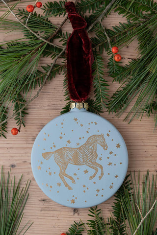 PRE-ORDER: "Snow Day" Block-Printed Horse Motif Ceramic Ornament – Snowlight Blue & Gold with Garnet Ribbon