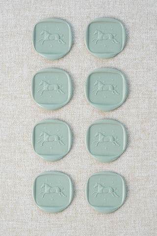 Set of eight duck egg wax seals with a horse and stars motif 