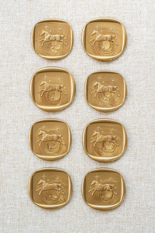 Set of eight metallic gold wax seals with a horse and stars motif 