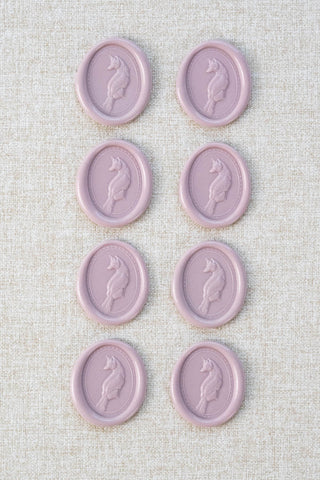Set of eight mauve fox motif wax seals
