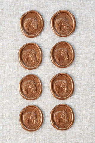 Set of eight metallic copper wax seals with a horse head motif 