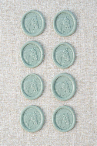 Set of eight light blue green / duck egg green wax seals with a horse head motif 