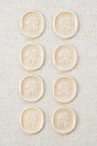 Set of eight metallic off-white cream equestrian rosette motif wax seals