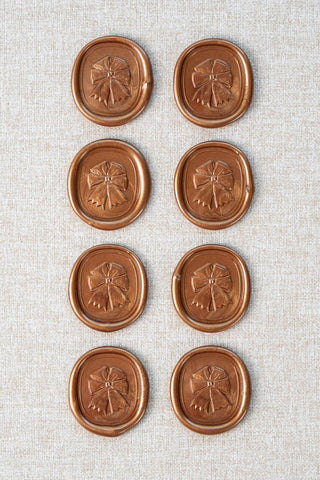 Set of eight metallic copper equestrian rosette motif wax seals