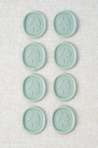 Set of eight duck egg green / light green blue equestrian rosette motif wax seals