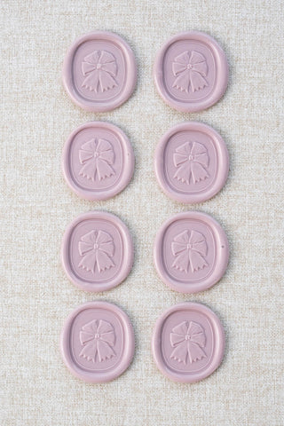 Set of eight mauve equestrian rosette motif wax seals