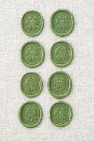 Set of eight sap green equestrian rosette motif wax seals