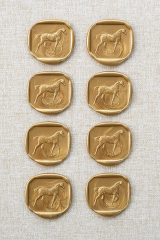 Set of eight metallic gold walking horse motif wax seals