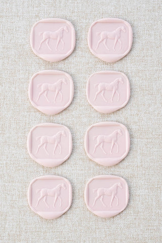 Set of eight light pink walking horse motif wax seals