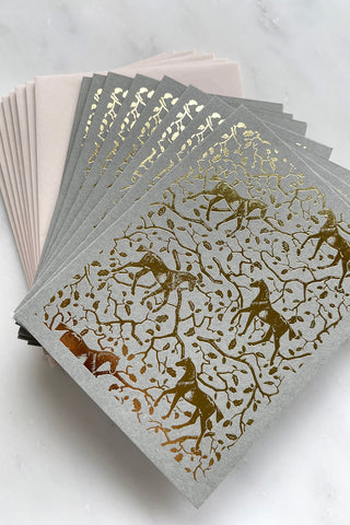 Photo of a set of 8 foil-stamped note cards featuring a horse and oak leaf and branch pattern printed in metallic gold foil on a muted sage card stock by equine artist Danielle Demers.