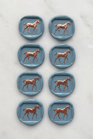 Photo of a set of 8 French blue horse wax seals with copper hand painted detail by equine artist Danielle Demers