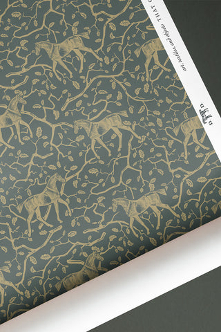 Roll of Amongst the Oaks wallpaper in the colorway "Deep Green Earth." Designed by equine artist Danielle Demers.