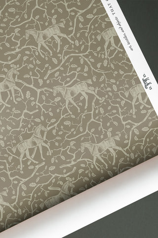 Roll of Amongst the Oaks wallpaper in the colorway "Green Clay." Designed by equine artist Danielle Demers.