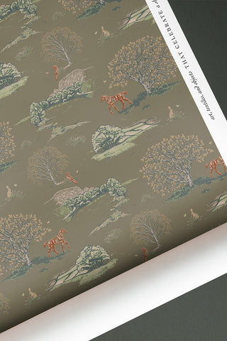 Roll of Countryside Toile wallpaper in the colorway "Moss Brown." Designed by equine artist Danielle Demers.