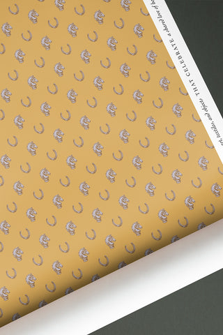 Roll of Heirloom & Heritage wallpaper in the colorway "Gamboge Yellow." Designed by equine artist Danielle Demers.